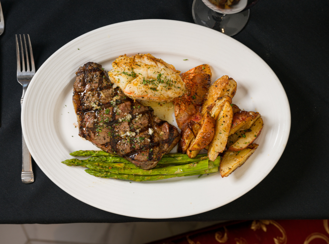 This steakhouse food photo features a seared ribeye plated with sides, styled for a restaurant’s menu and advertising. We use lighting that brings out texture, grill marks, and the perfect doneness of each cut. Our photos are made for upscale menus, websites, and promotional print materials. Steak, seafood, sides, and craft cocktails—we shoot it all with a clean, editorial look.